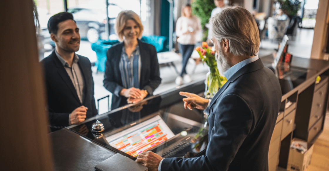 Business travelers at hotel check-in